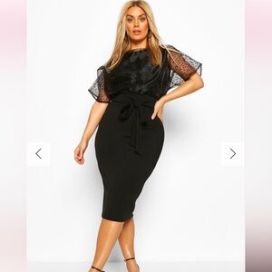 Elegant Black Dress with Sheer Polka Dot Sleeves